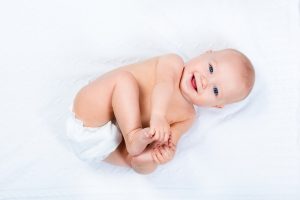 Infant holding feet