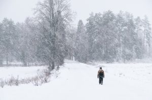 Man Walking in Snow