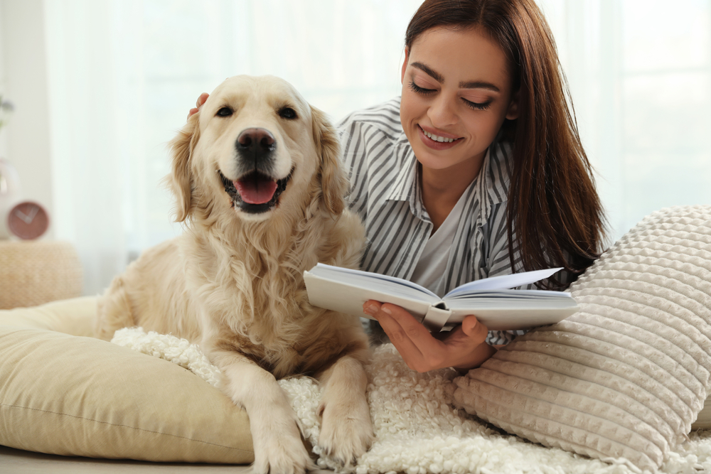 Women Reading With Dog