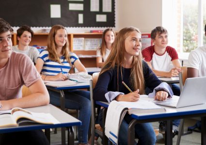 Students,Listening,To,Female,Teacher,In,Classroom For schools